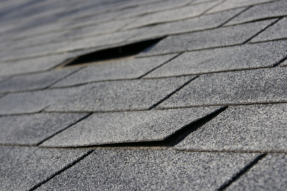 loose shingles on a roof