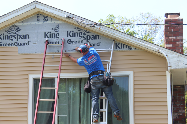 Action shot of siding job in the Tolland County area by AWS