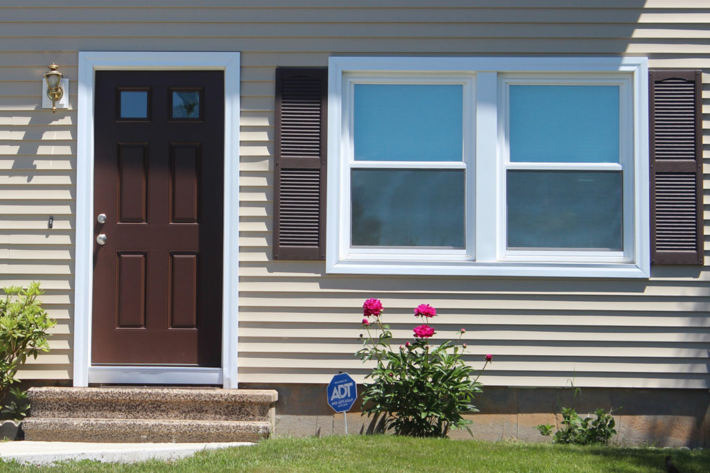 hickory brown front door for beige house