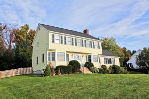 Yellow New England Style Colonial House