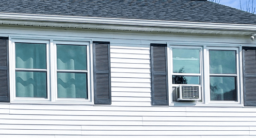 Double hung windows on white home